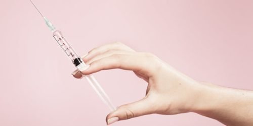 hand, holding, syringe, background, studio, plain, pink, finger, fingers, needle