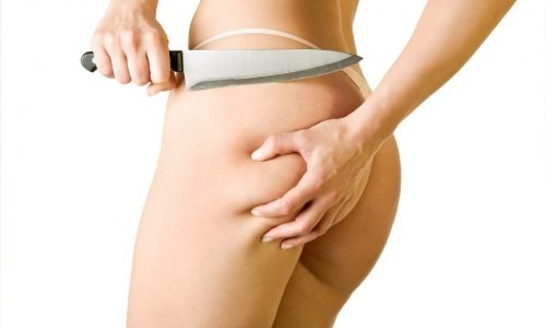 girl cut off her cellulite girl cut off her cellulite, isolated on white