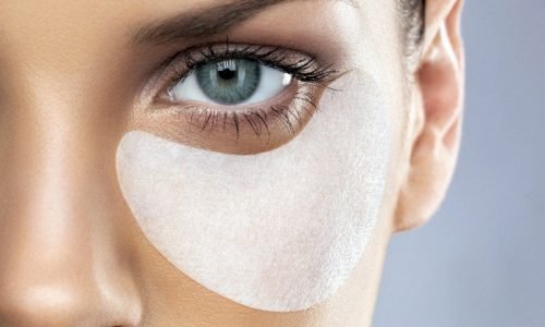 w960 (1) Close-up of young woman with make-up patch under eye, studio shot